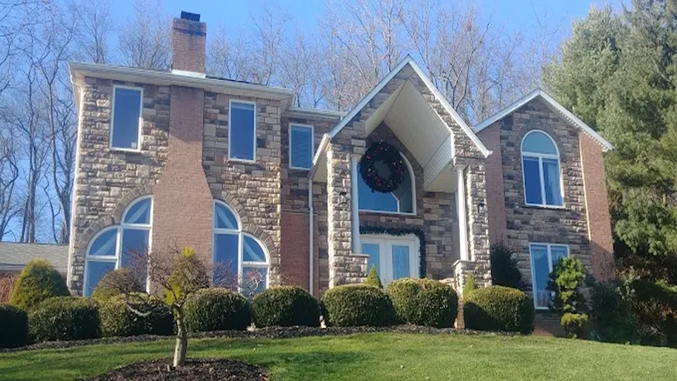Stone installation on home 