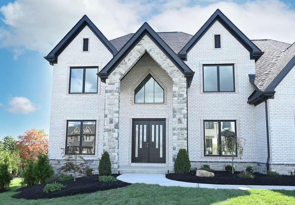 house with white stone veneer installation
